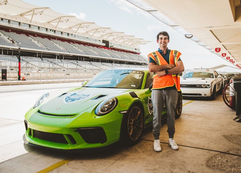 Jack at the racetrack with a Porsche